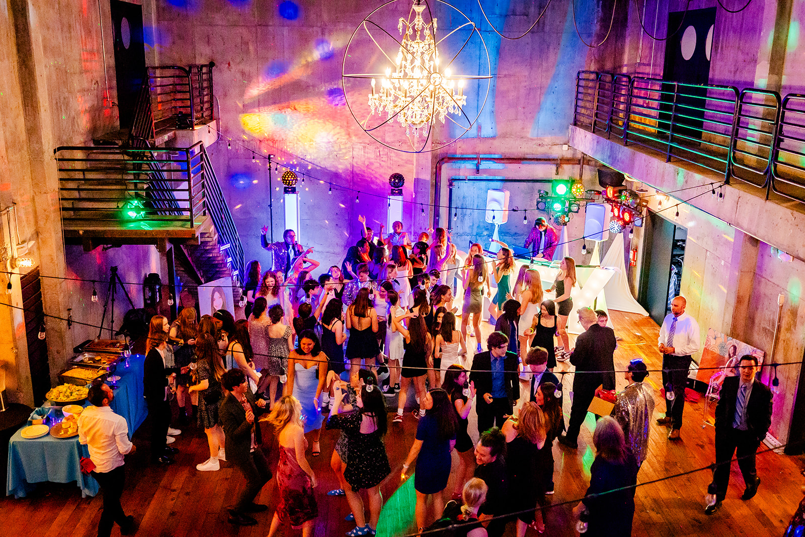 Teenagers dance on the dance floor during a Bat Mitzvah party catered by cake shops in bellevue