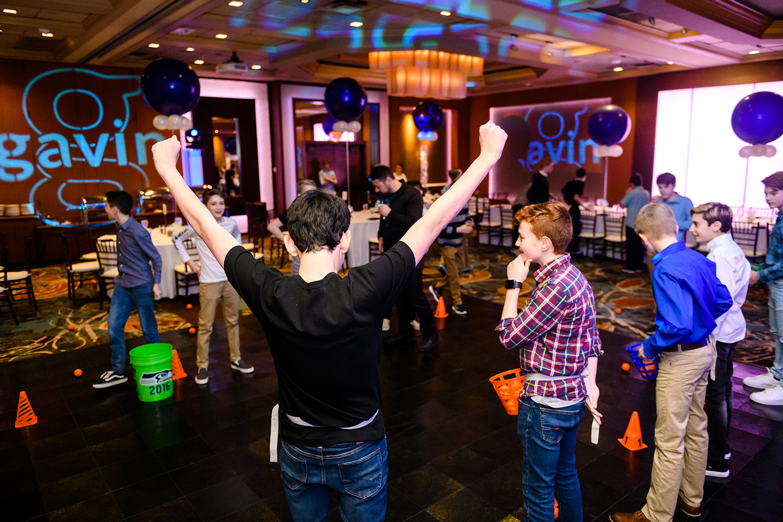 A group of boys play party games on the dance floor at one of the best Mitzvah Venues Seattle