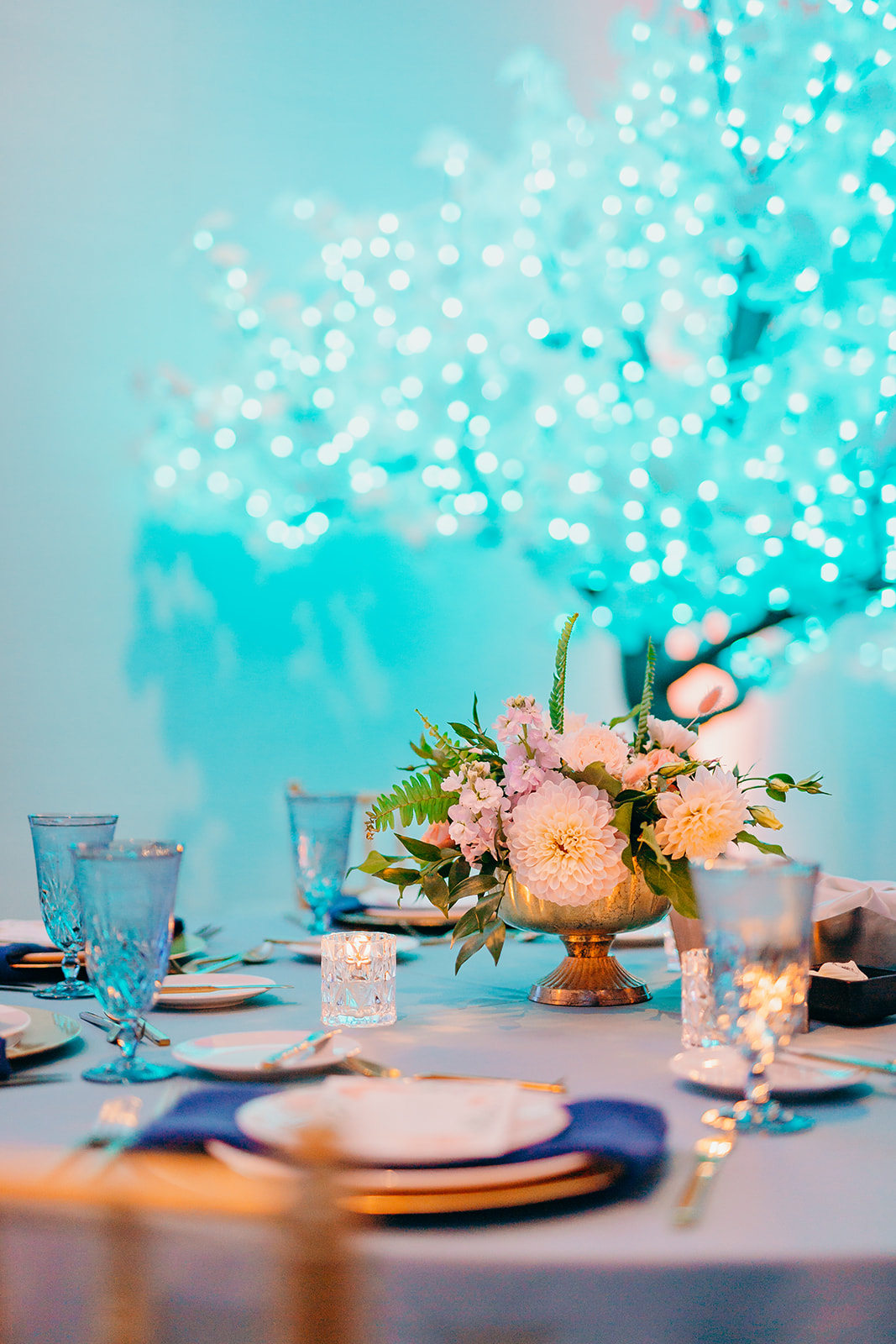 Details of an event table setting with a floral centerpiece