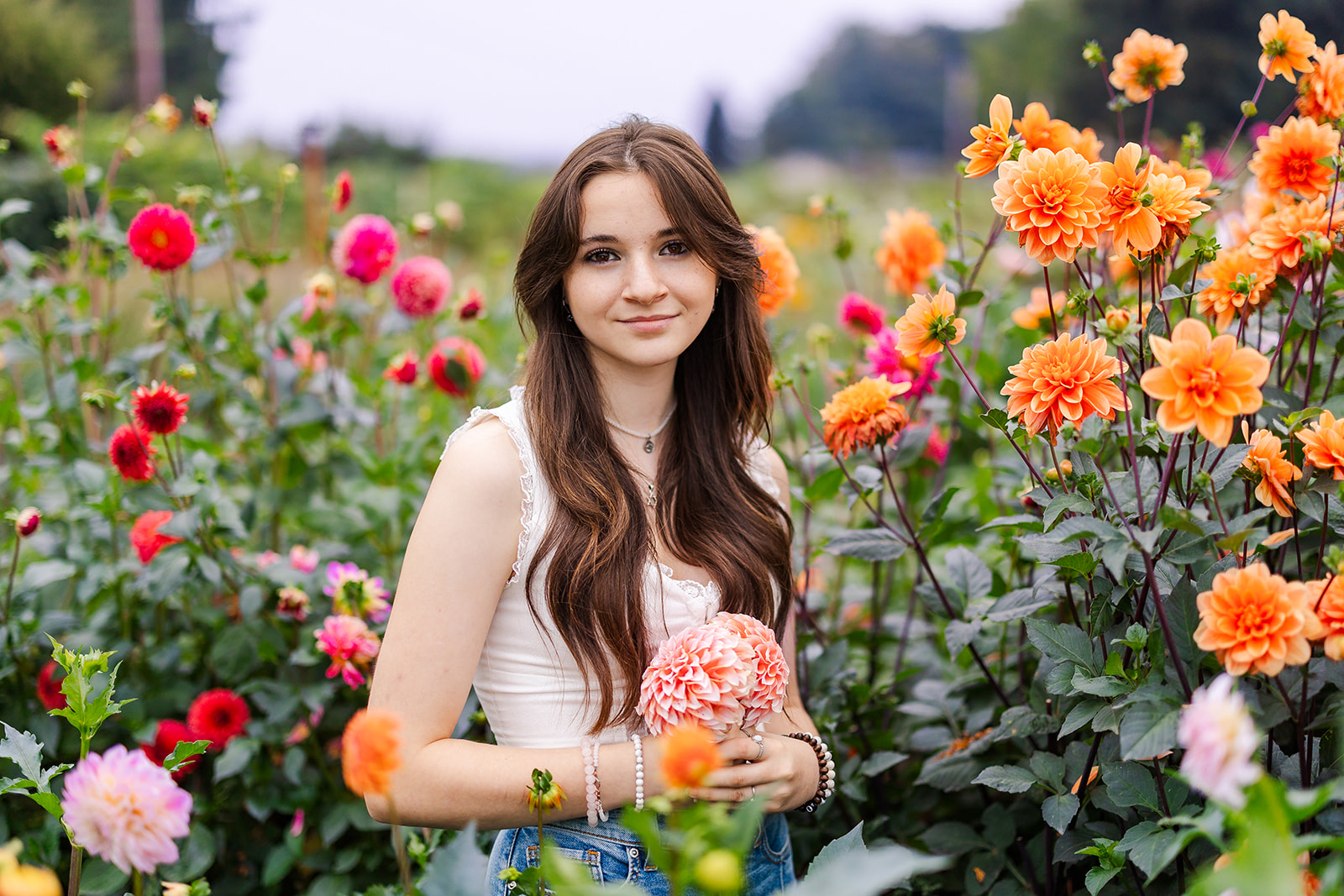 A high school senior explores a vibrant garden after visiting a Seattle Nail Salon