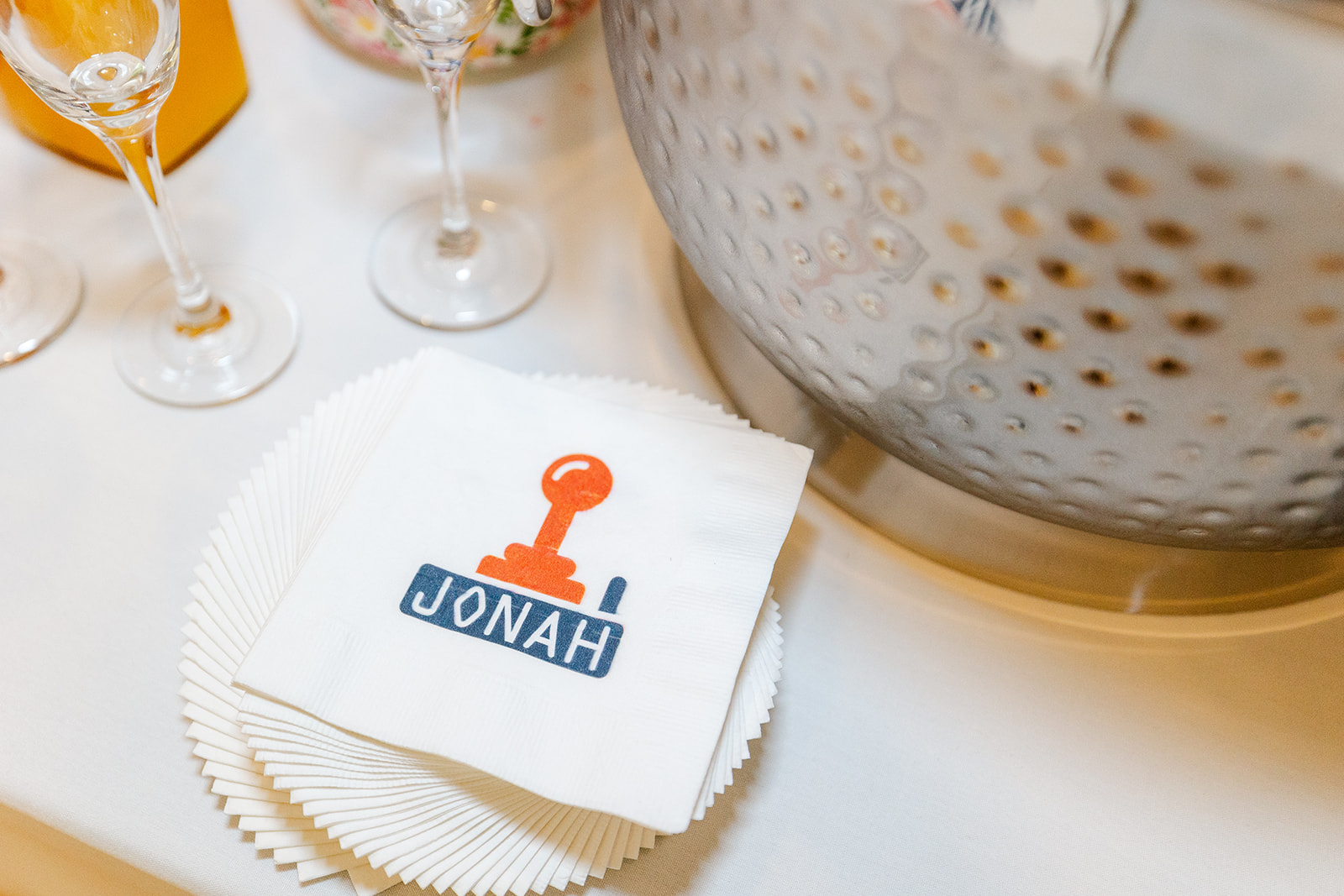 Details of a custom bar mitzvah napkin on a table