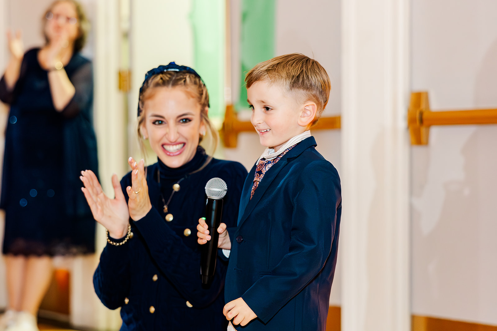 A young boy gives a speech with mom's help after enjoying some catering in Kirkland, WA