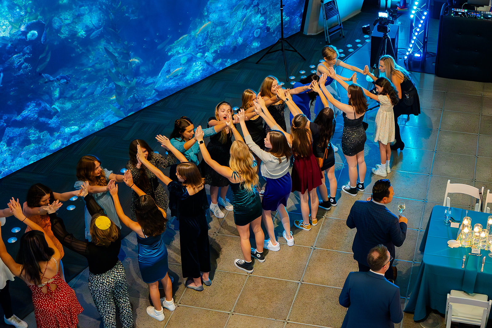A group of girl form an arch at a reception before heading to kid-friendly hotels in Seattle